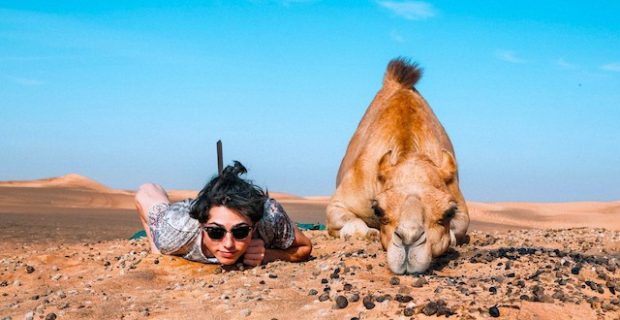 Man and camel writing